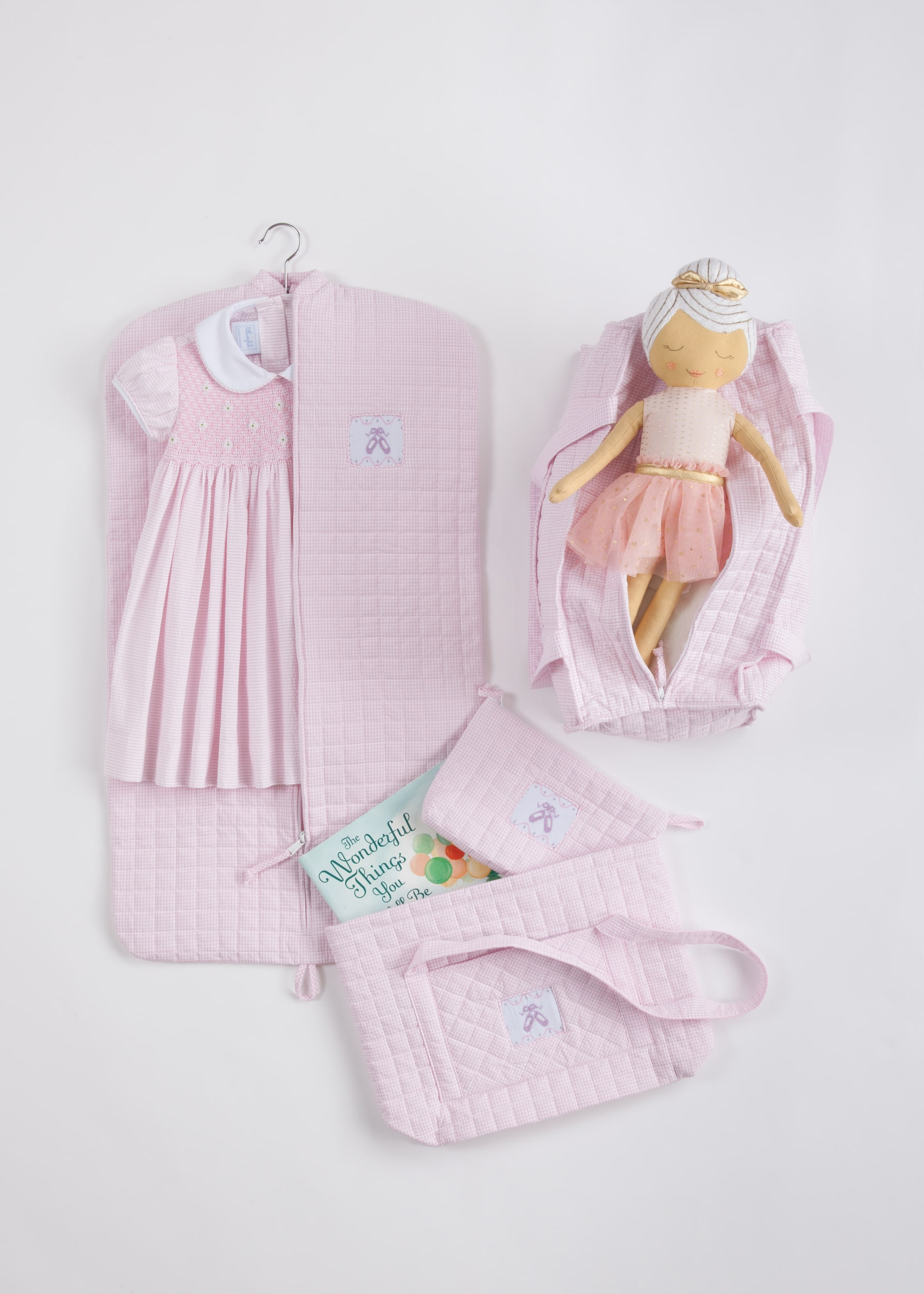 Frilly pink girl's dress and doll