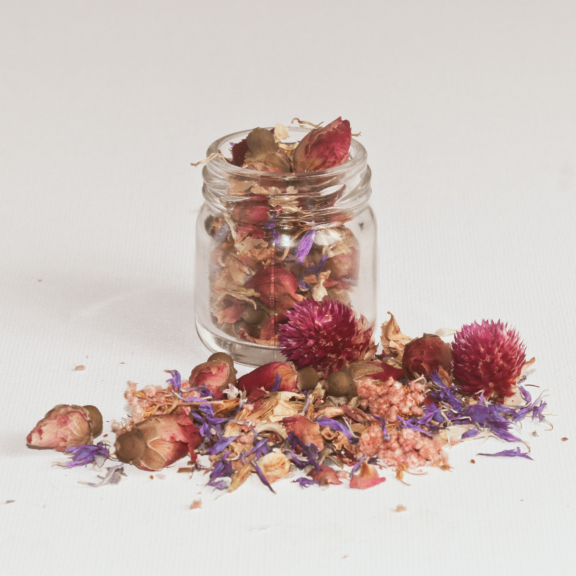 Glass jar filled with dried flowers