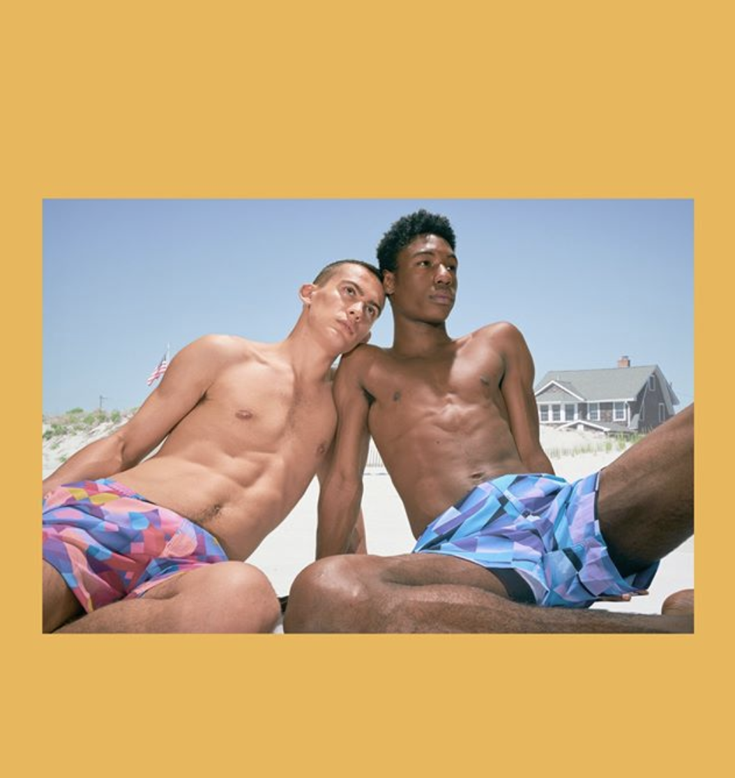 Male models on the beach in HOMOCO swimming trunks