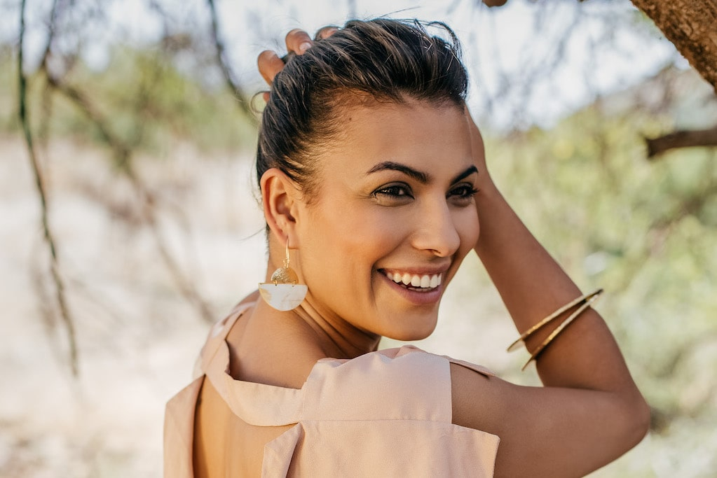 Woman wearing handmade earrings